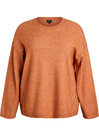 Loose knit sweater with prominent seams